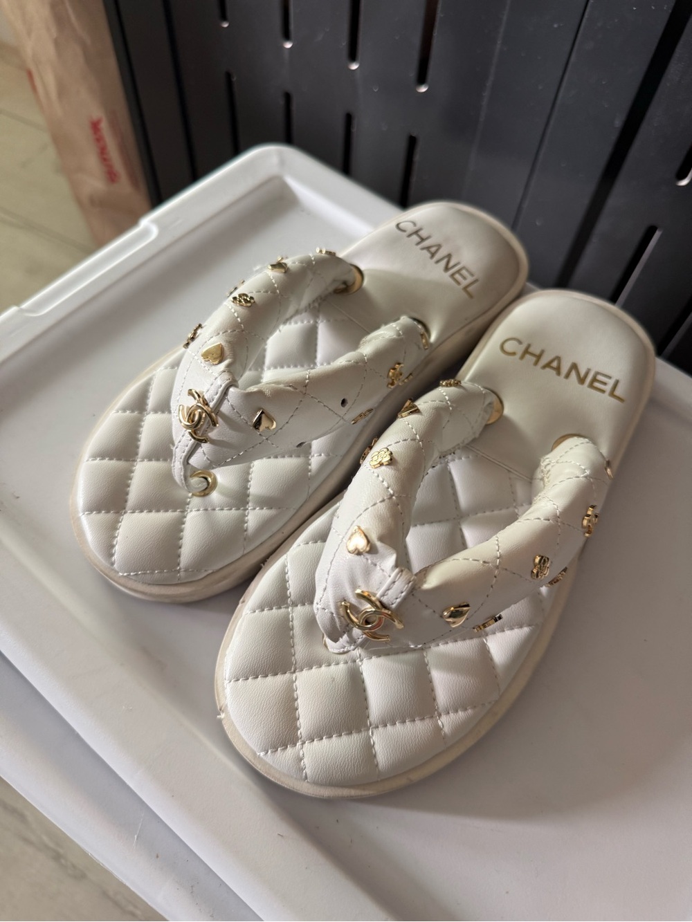 CHANEL White Quilted Thong Sandals with Gold Charms